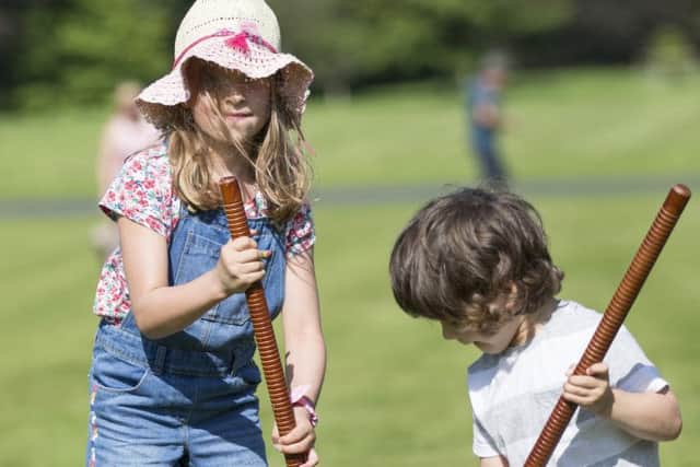 Thousands enjoy the massed pipe bands and dancing displays at Floors Castle.