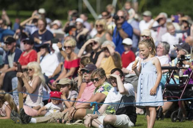 Thousands enjoy the massed pipe bands and dancing displays at Floors Castle.