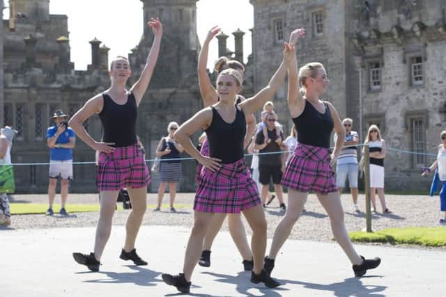 Thousands enjoy the massed pipe bands and dancing displays at Floors Castle.