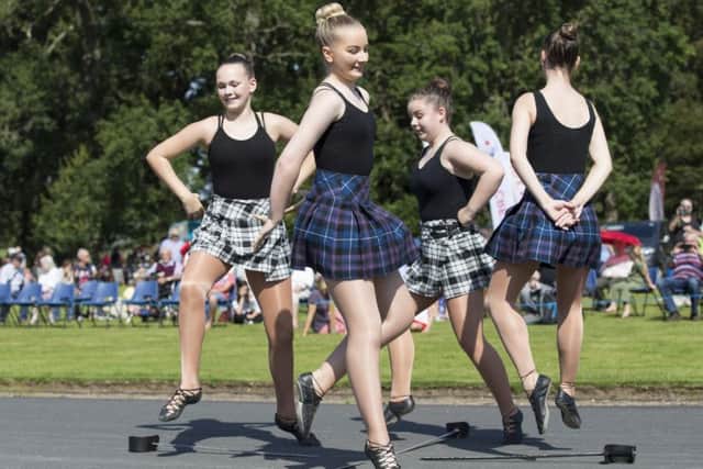 Thousands enjoy the massed pipe bands and dancing displays at Floors Castle.