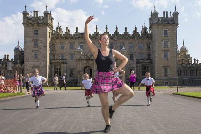 Thousands enjoy the massed pipe bands and dancing displays at Floors Castle.