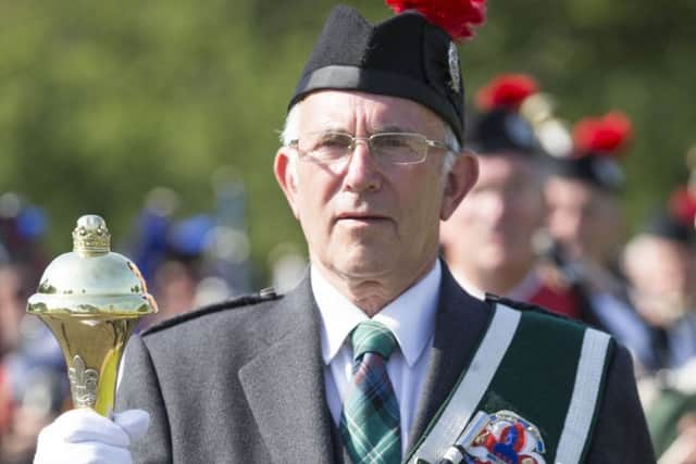 Thousands enjoy the massed pipe bands and dancing displays at Floors Castle.