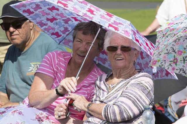Thousands enjoy the massed pipe bands and dancing displays at Floors Castle.