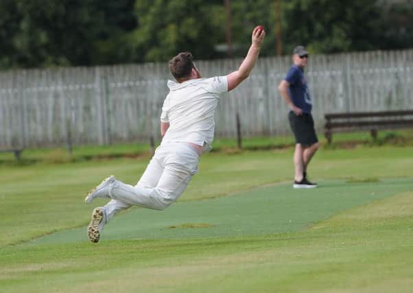 Although not a catch, Bob Wilkinson makes a flying stop (picture by Grant Kinghorn).