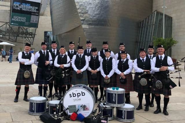Scottish Borders Pipe Band performs at the Guggenheim museum in Bilbao as part of the Getxo International Folk Festival.