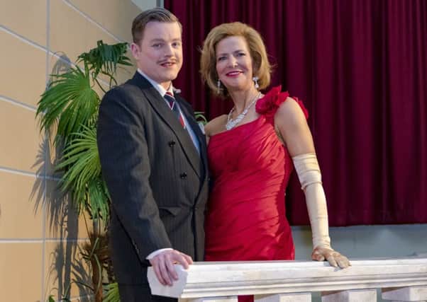 Society chairperson Julia Wailes-Fairbairn with Alan Thomson in its 2018 production of Dirty Rotten Scoundrels.