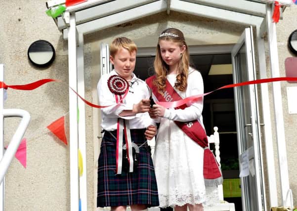 Langlee lad and lass, Lewis Hudson and Chloe Noble, cut the ribbon to start the day's events.