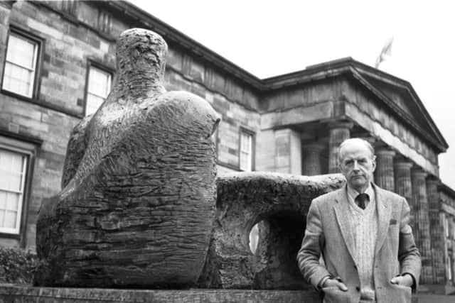 Curator Douglas Hall stands beside one of the outdoor sculptures in the gardens of the Scottish Gallery of Modern Art in Belford Road Edinburgh in 1986.