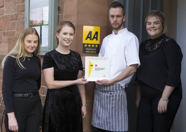 Alasdair and Ashley Wilkie, owners of Capon Tree Town House, with staff Beth Thomson, left, and Rhianne Miller, right, celebrating their fir st AA Rosette.