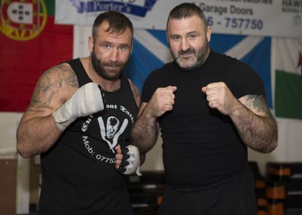 Garth 'Gumpy' Walker, of Hawick, right, the UK champion, with Luke Atkin, a twice former world champion in bare knuckle boxing (picture by Brian Sutherland).