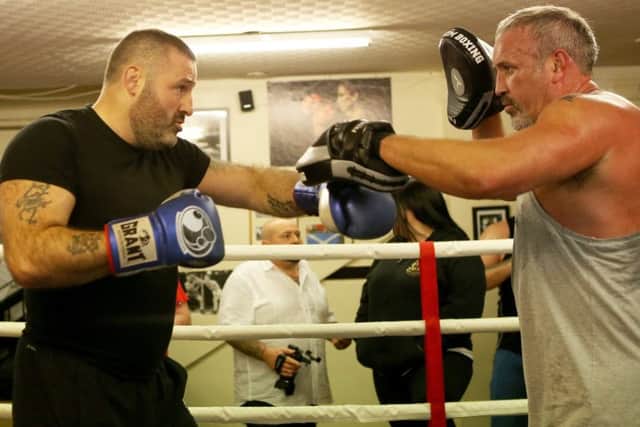 Gareth 'Gumpy' Walker, left, who is defending his UK title in November, works the pads with Shaun Smith (picture by Brian Sutherland)
