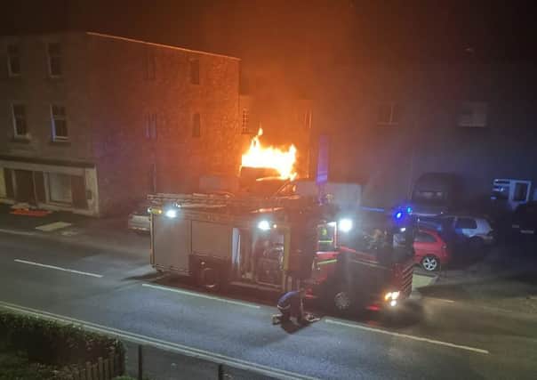 Fire crews battle a fire outside Bongate Garage, Jedburgh. Photo: Kym Hall.