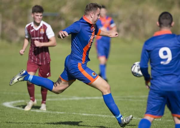 Lewis Swaney scores the only goal in Hawick Royal Albert United's 1-0 win over Arniston Rangers (picture: Brian Sutherland)