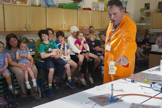 Youngsters enjoy a science demonstration.