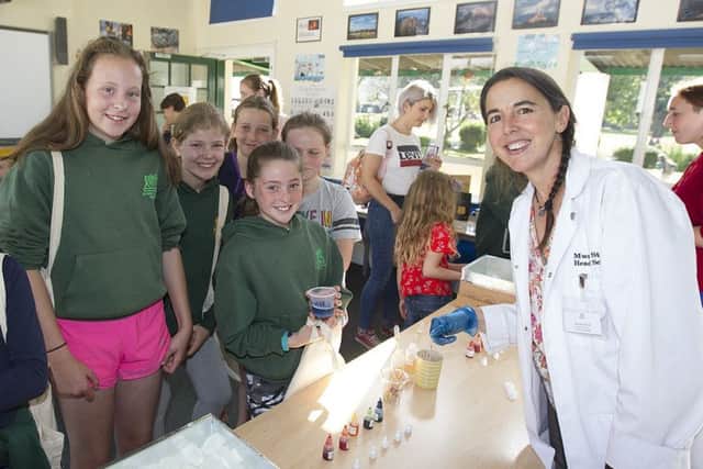 Head of science Mwara Stuart makes soap with Olivia Richards and her friends at Melrose.
