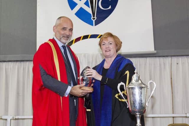 Nick Bannerman from Hawick receives his honorary fellowship from college principal Angela Cox.