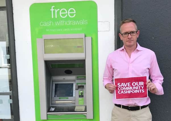 Borders MP John Lamont at a cashpoint in Chirnside.