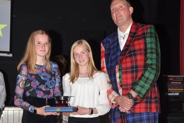 Emma Brus, left, and Grace McWhinnie shared the prize for athletes' athlete of the year, as well as being named top senior female and top junior female respectively.