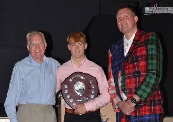 The president's trophy and top senior male accolade was collected by Finn Douglas, centre, flanked by John Steede and Doddie Weir.