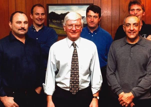 Late firefighter Alex Merry with colleagues.