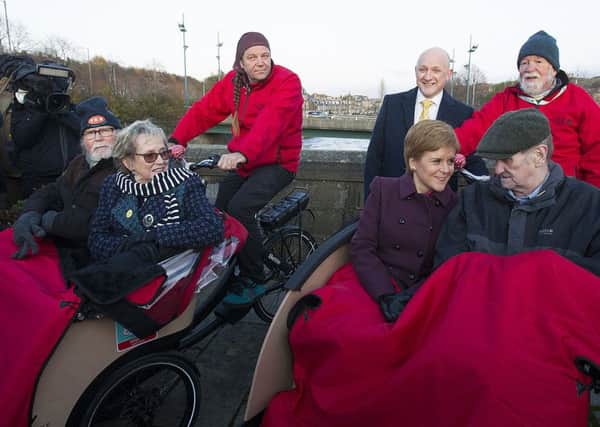 Keith Irving, back left, pedalling a trishaw during Nicola Sturgeon's recent visit to Hawick.