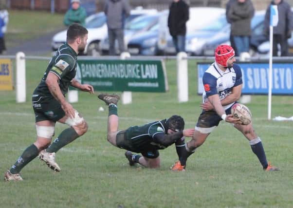 Luca Berti of Selkirk feeds out after eluding a Hawick tackle, although the Greens won 15-22 (picture by Grant Kinghorn)