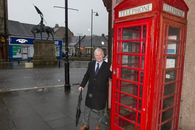 Hawick councillor Davie Paterson at one of the town's phone boxes, opposite Oliver Place.