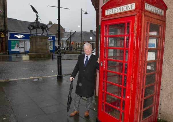 Hawick councillor Davie Paterson at one of the town's phone boxes, opposite Oliver Place.