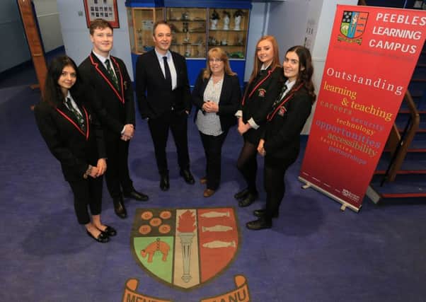 Peebles High School headteacher Campbell Wilson and Scottish Borders Council chief executive Tracey Logan with senior pupils today.