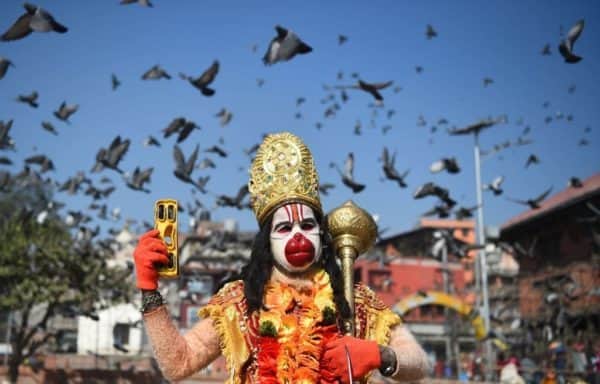 A Hindu holy man dressed as the monkey god Hanuman ahead of Maha Shivaratri at the Pashupatinath temple in Kathmandu in February 2018 (Photo: PRAKASH MATHEMA/AFP via Getty Images)